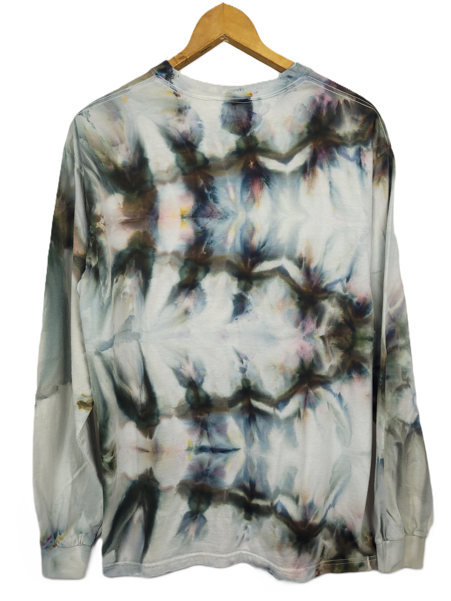 Tie-dye long-sleeve shirt on a wooden hanger with a white background