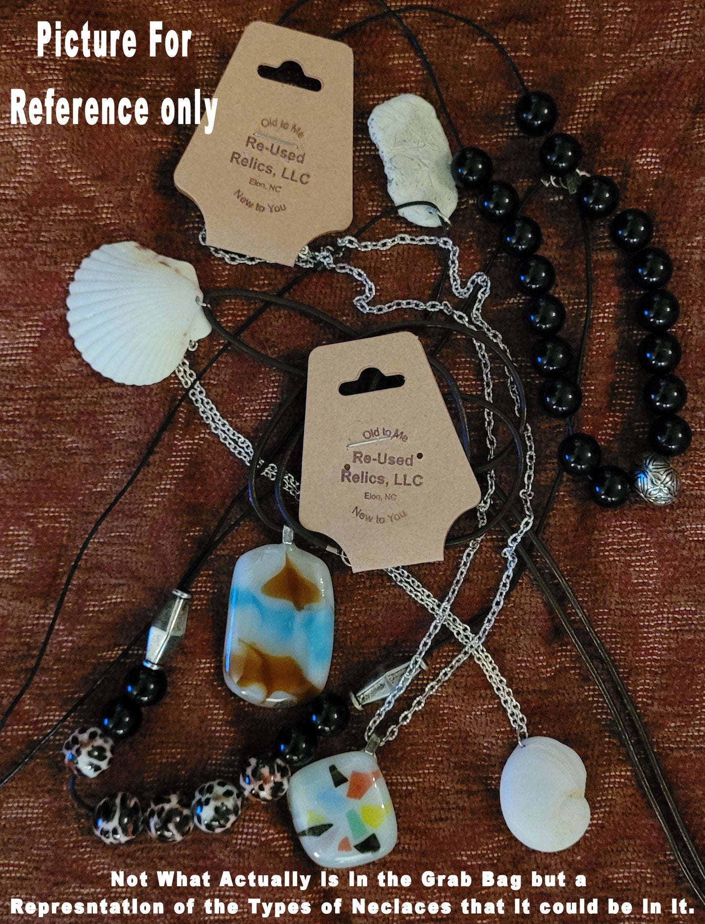 pile of various necklaces on a brown background