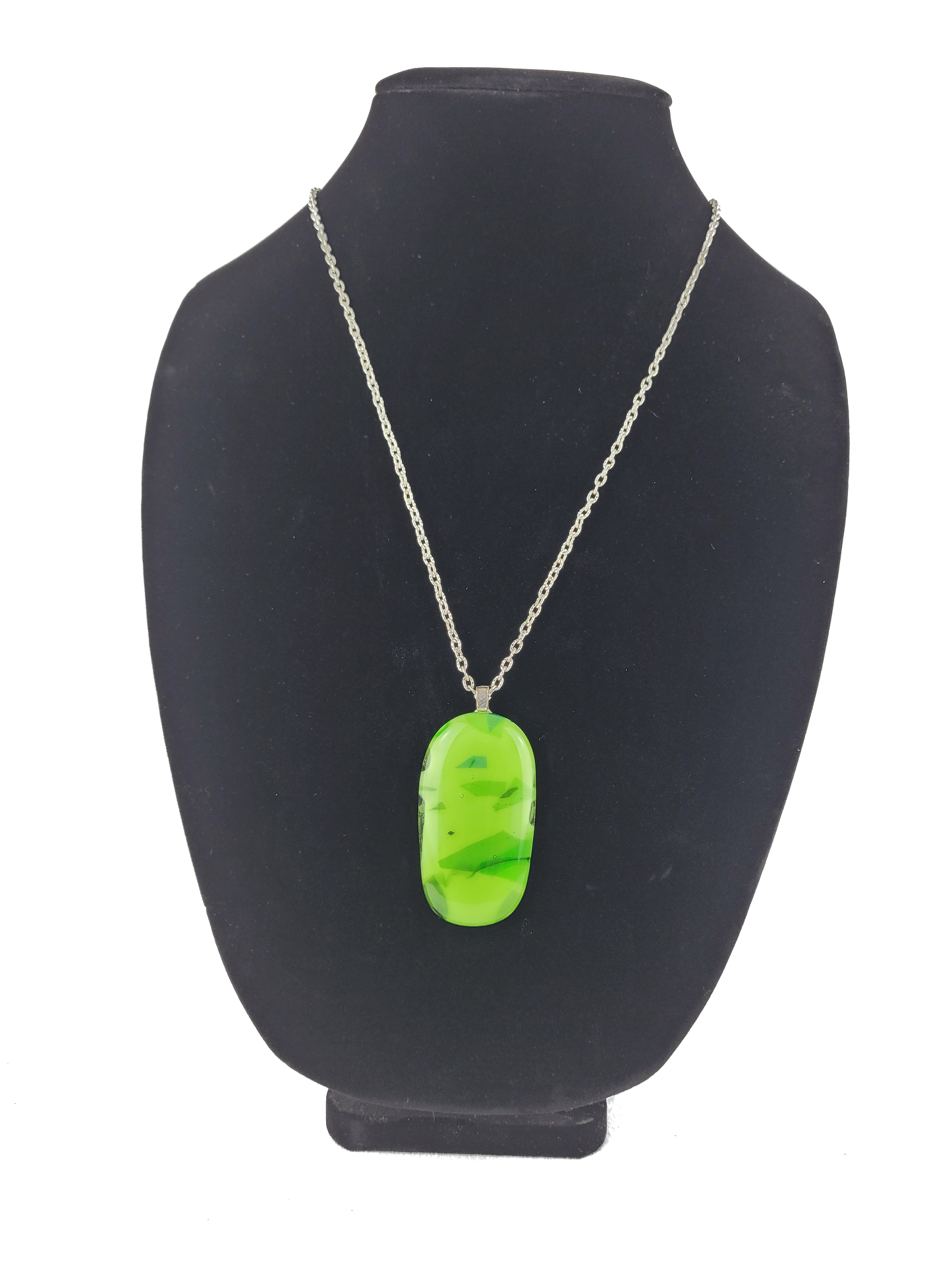 Neon green pendant necklace on a black mannequin bust