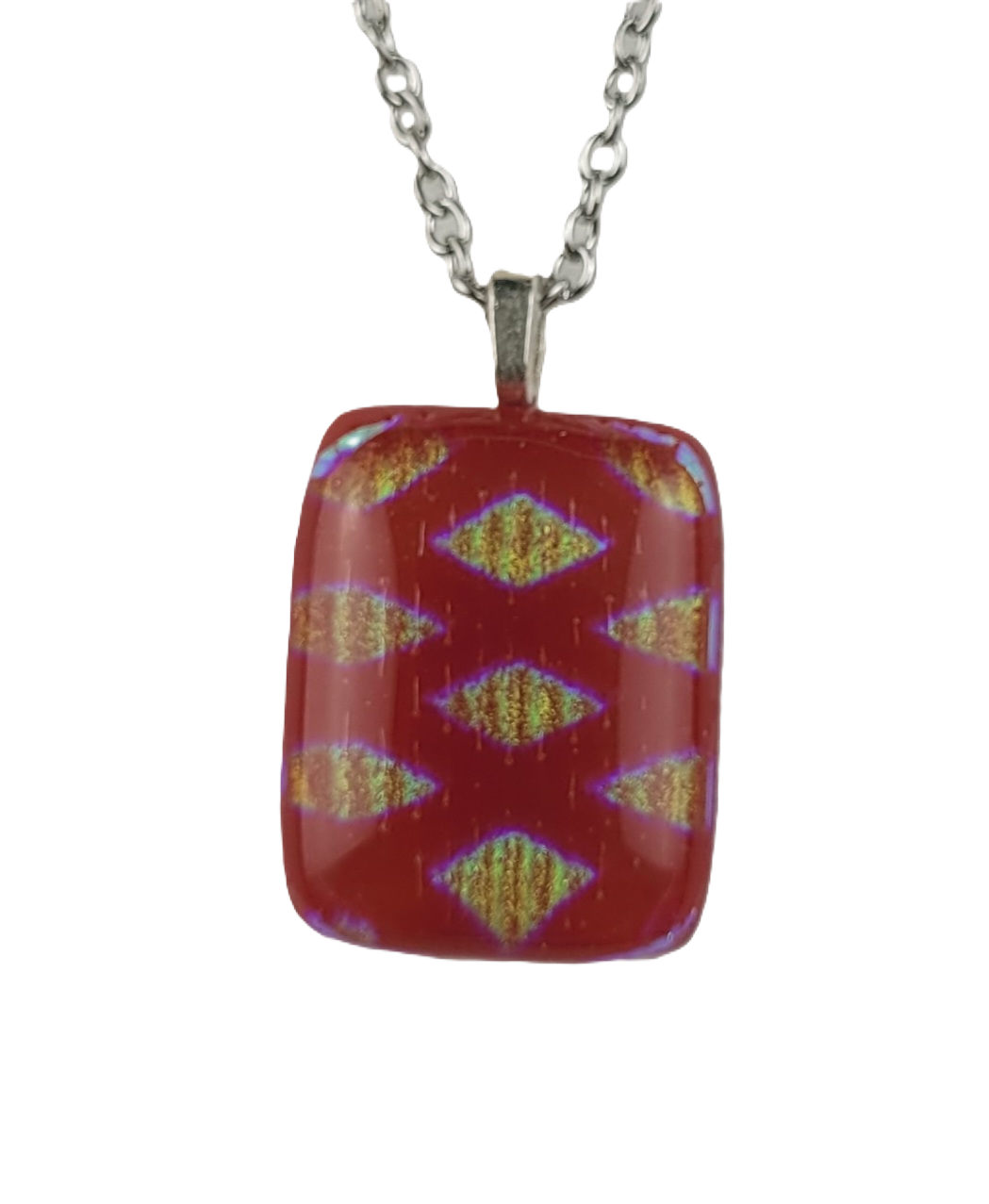 Red pendant with a pattern on a silver chain against a white background