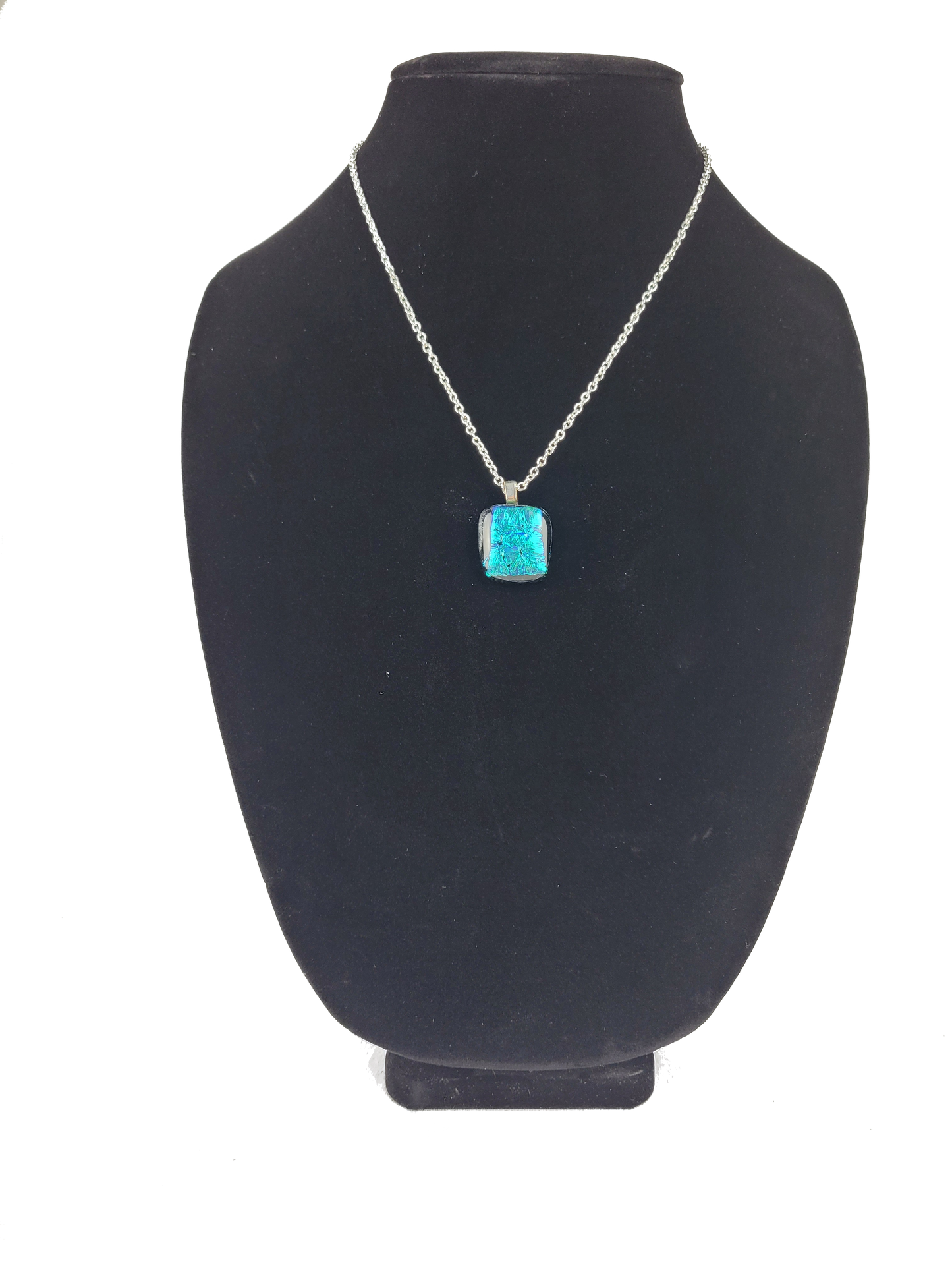 Turquoise pendant necklace on a black bust