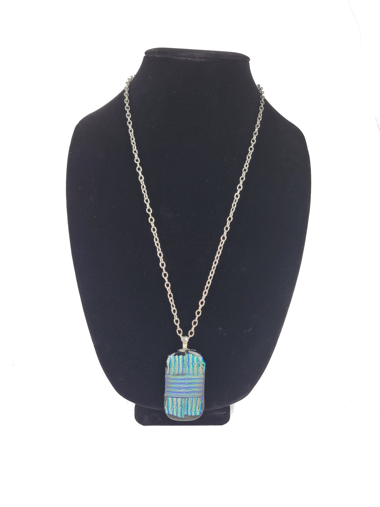 Necklace with a blue pendant on a black bust