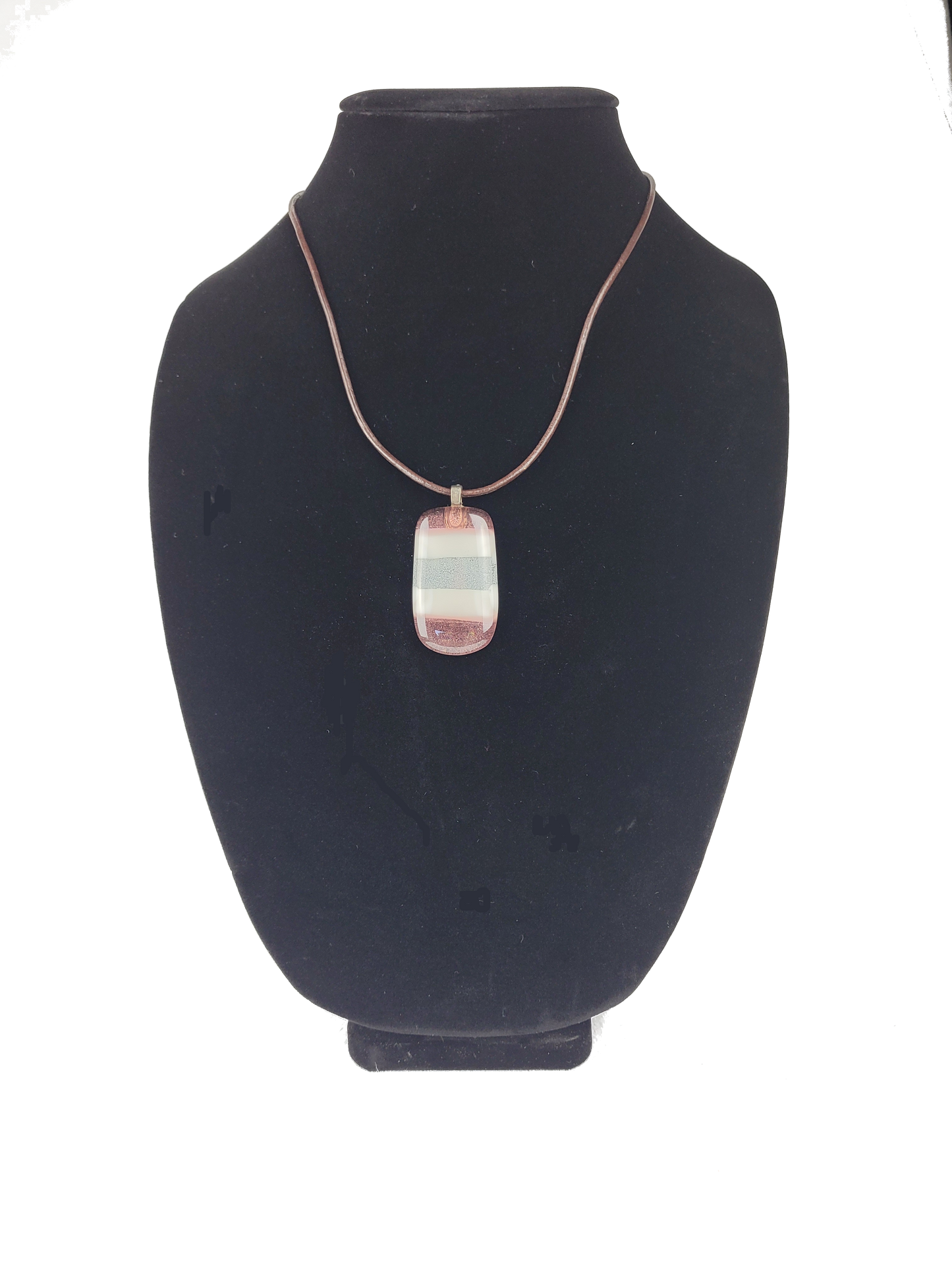Necklace with a pendant on a black bust against a white background