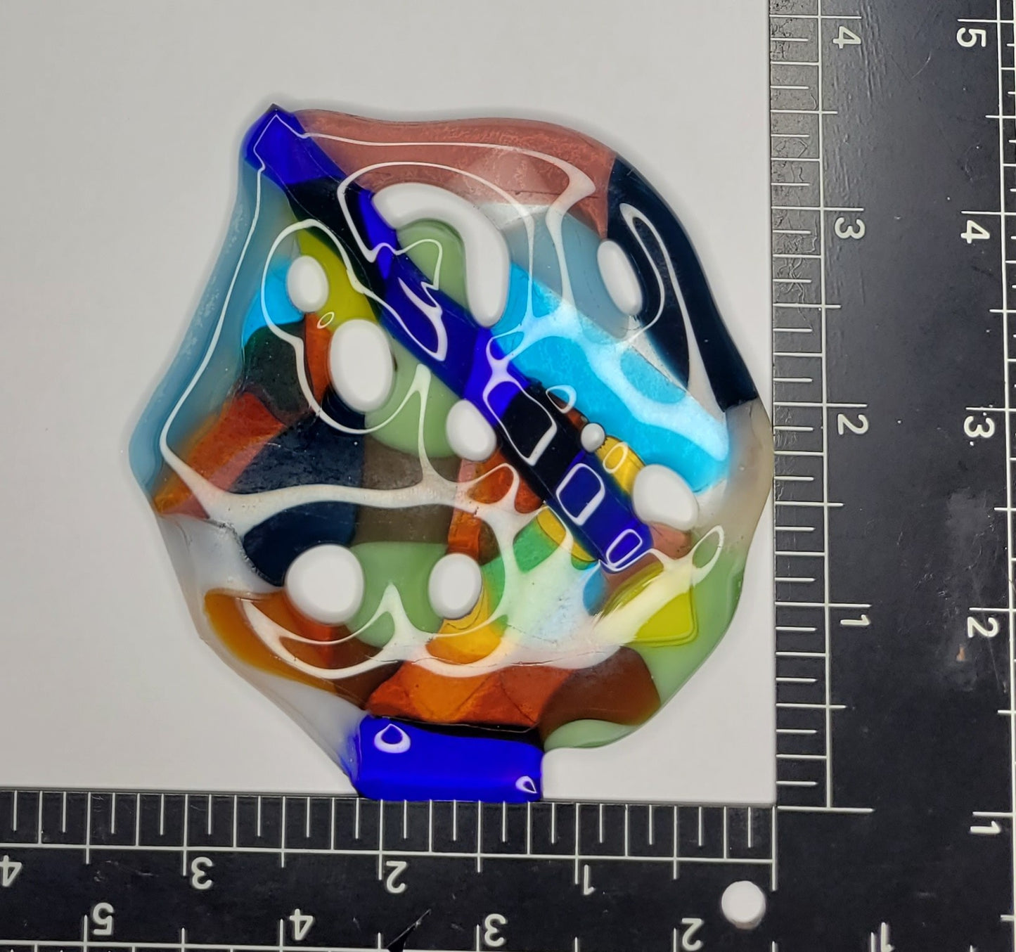 Colorful suncatcher with ruler for scale