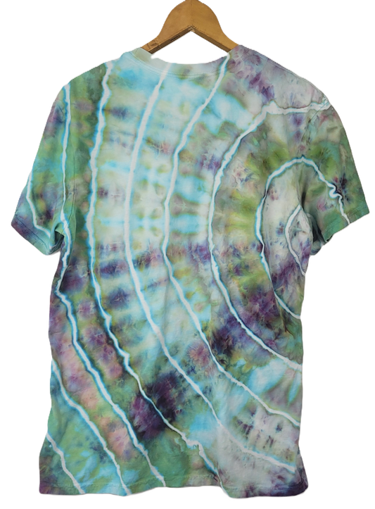 Tie-dye t-shirt with wavy pattern on a hanger