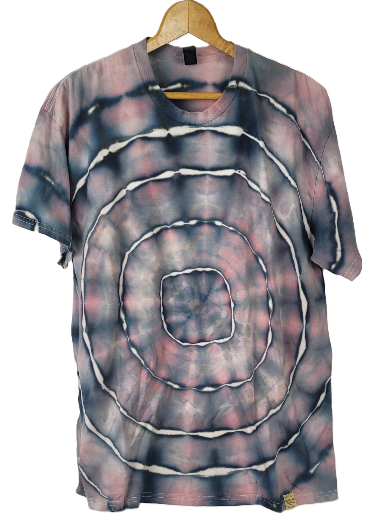 Tie-dye t-shirt with concentric circle pattern on a hanger