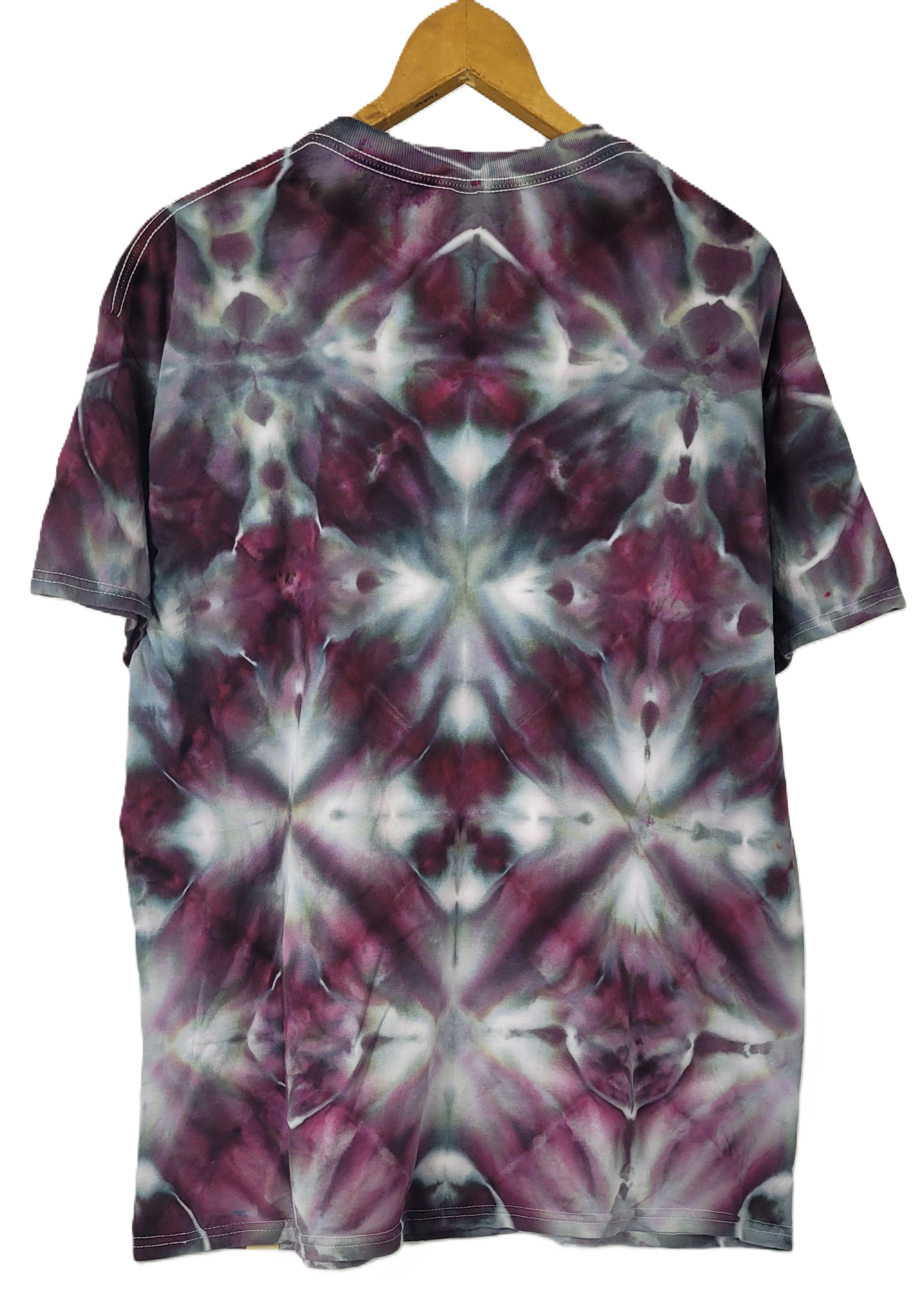 Tie-dye t-shirt with a geometric pattern on a hanger