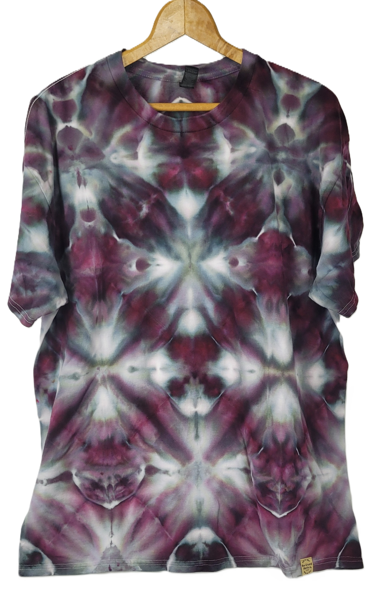 Tie-dye shirt on a hanger with a white background