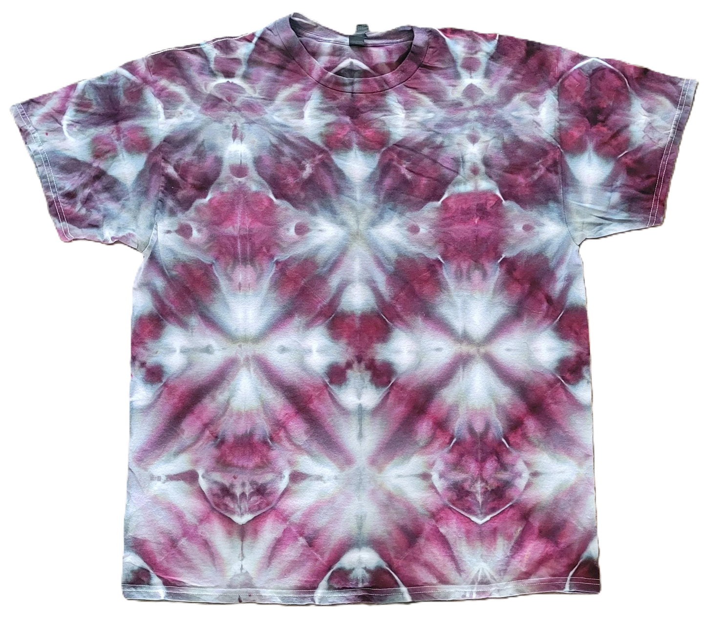 Tie-dye t-shirt with a pink and white pattern on a white background