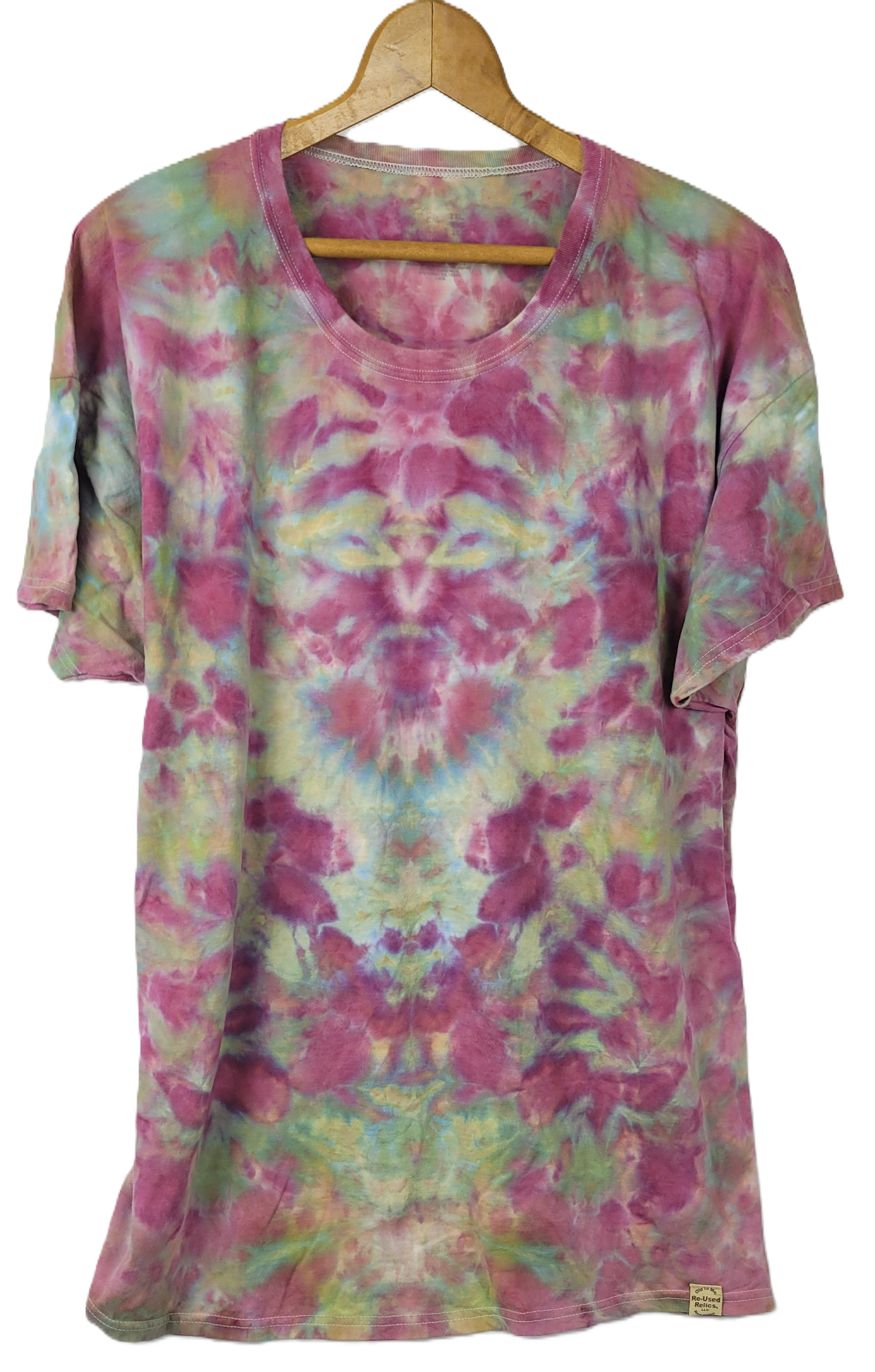 Tie-dye t-shirt on a hanger with a white background