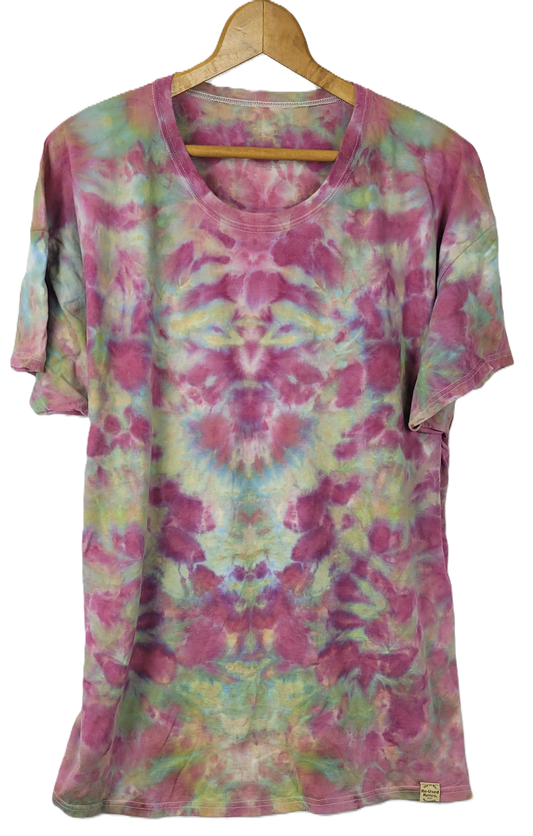Tie-dye t-shirt on a hanger with a white background