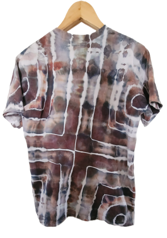 Tie-dye shirt on a wooden hanger with a white background