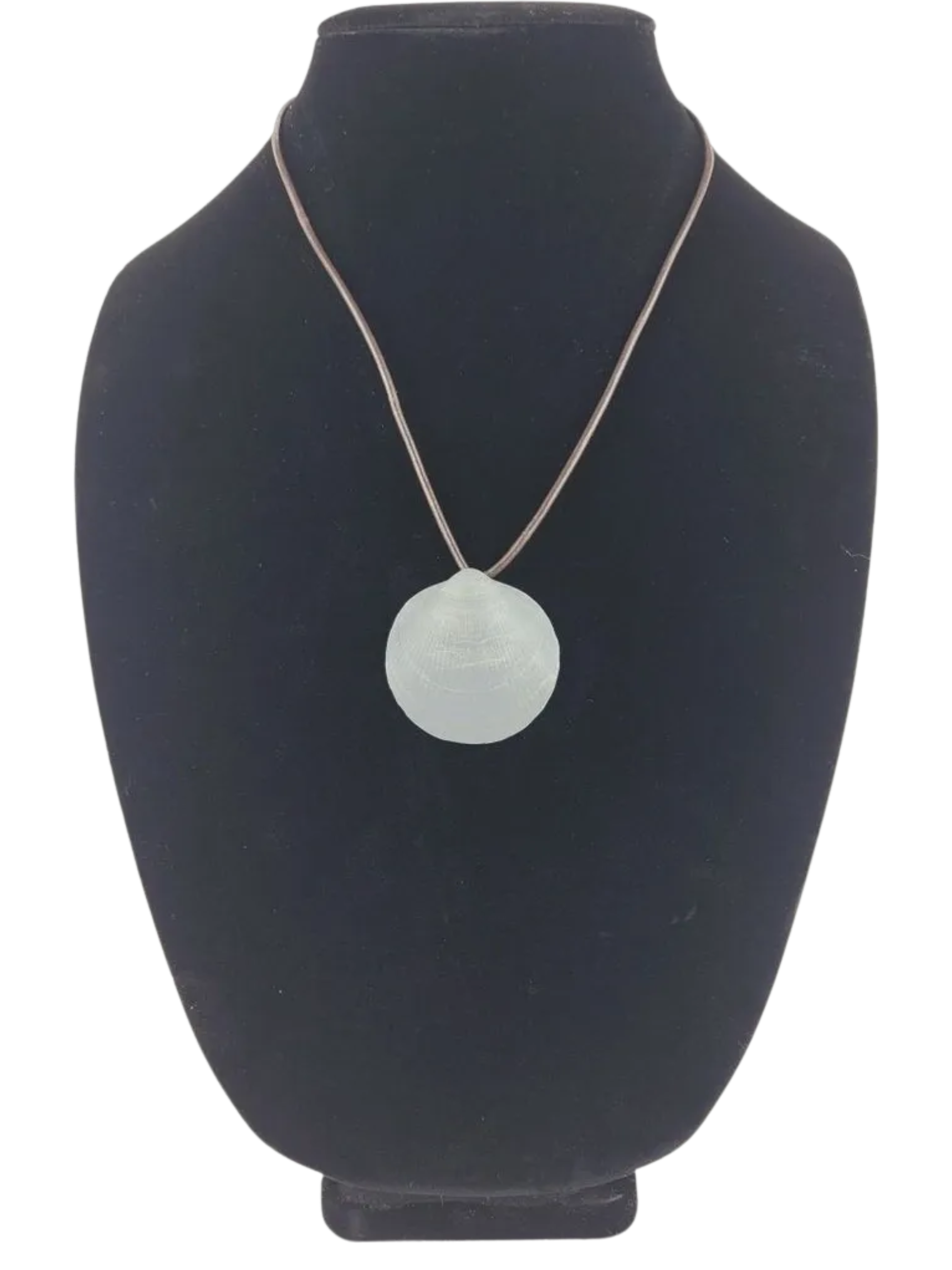 Necklace with a round pendant on a black bust