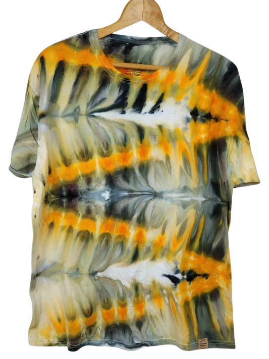 Tie-dye t-shirt with orange, black, and gray pattern on a hanger