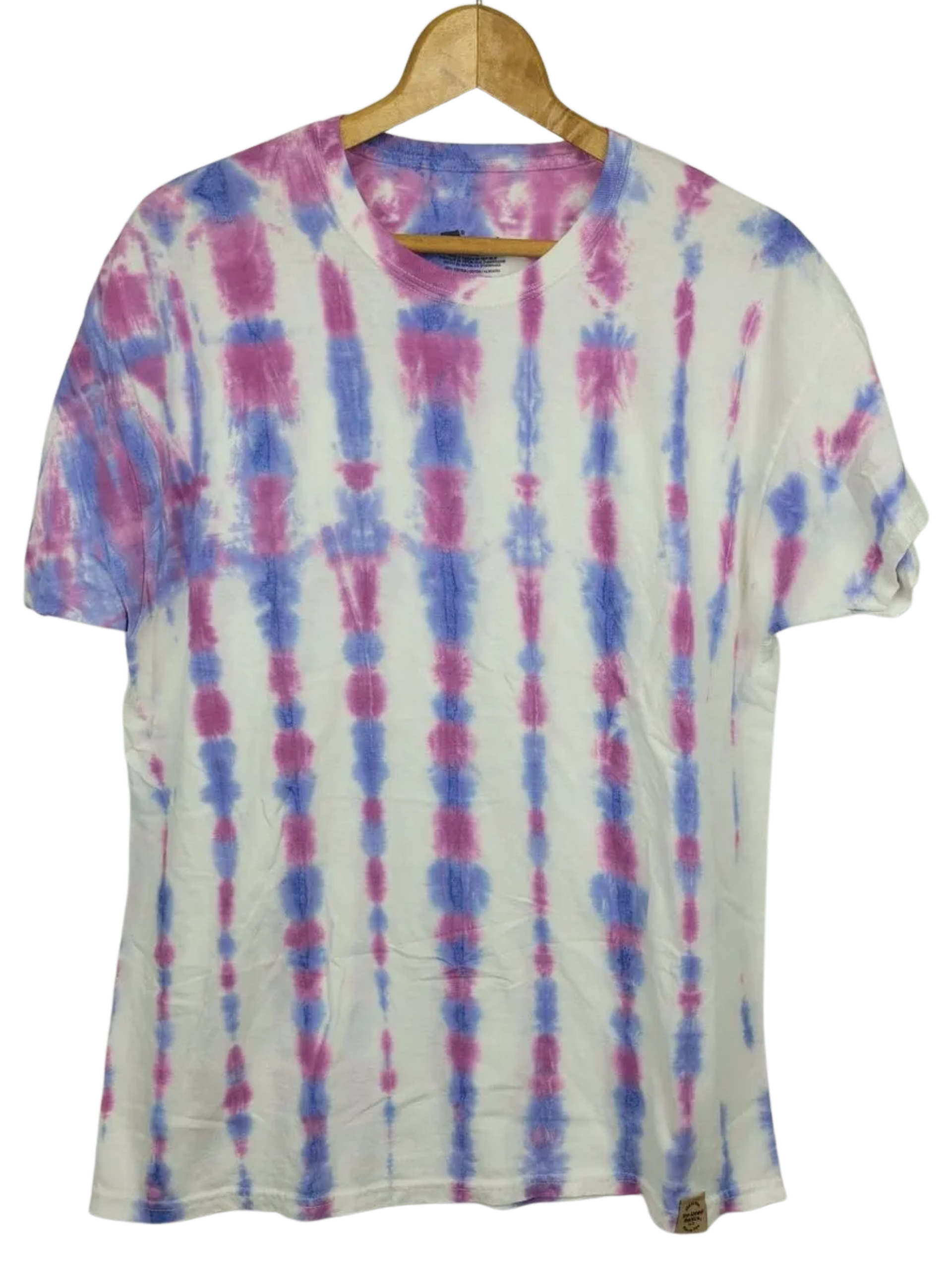 Tie-dye t-shirt with pink and blue patterns on a wooden hanger