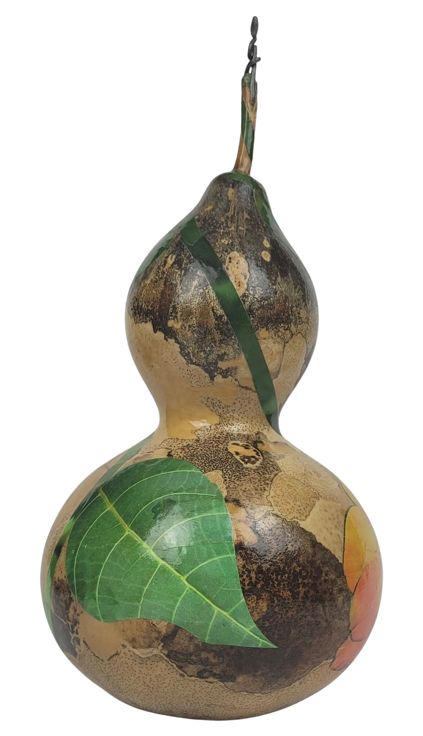 Decorative gourd with a green leaf on a white background