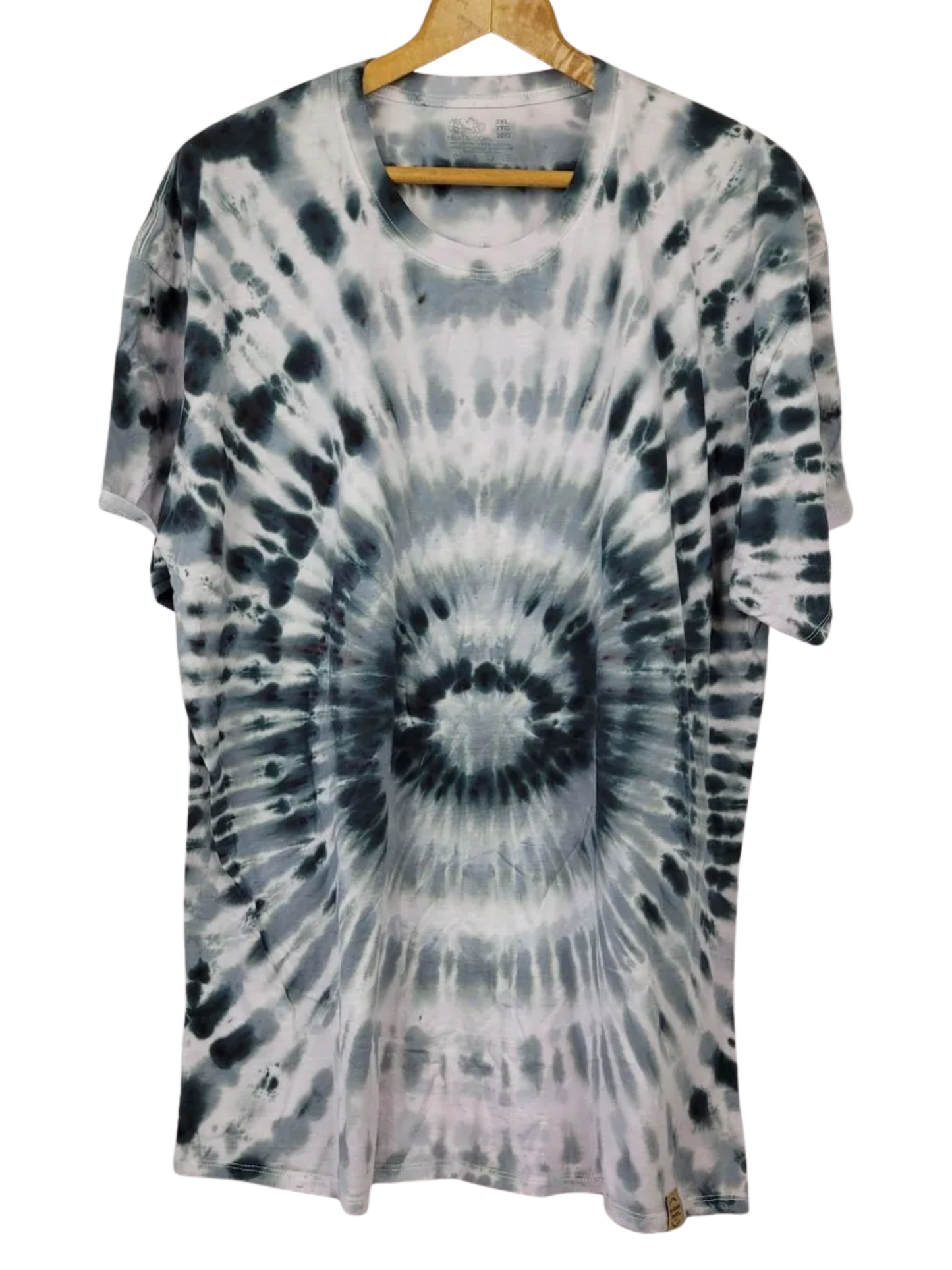 Tie-dye t-shirt on a hanger with a white background