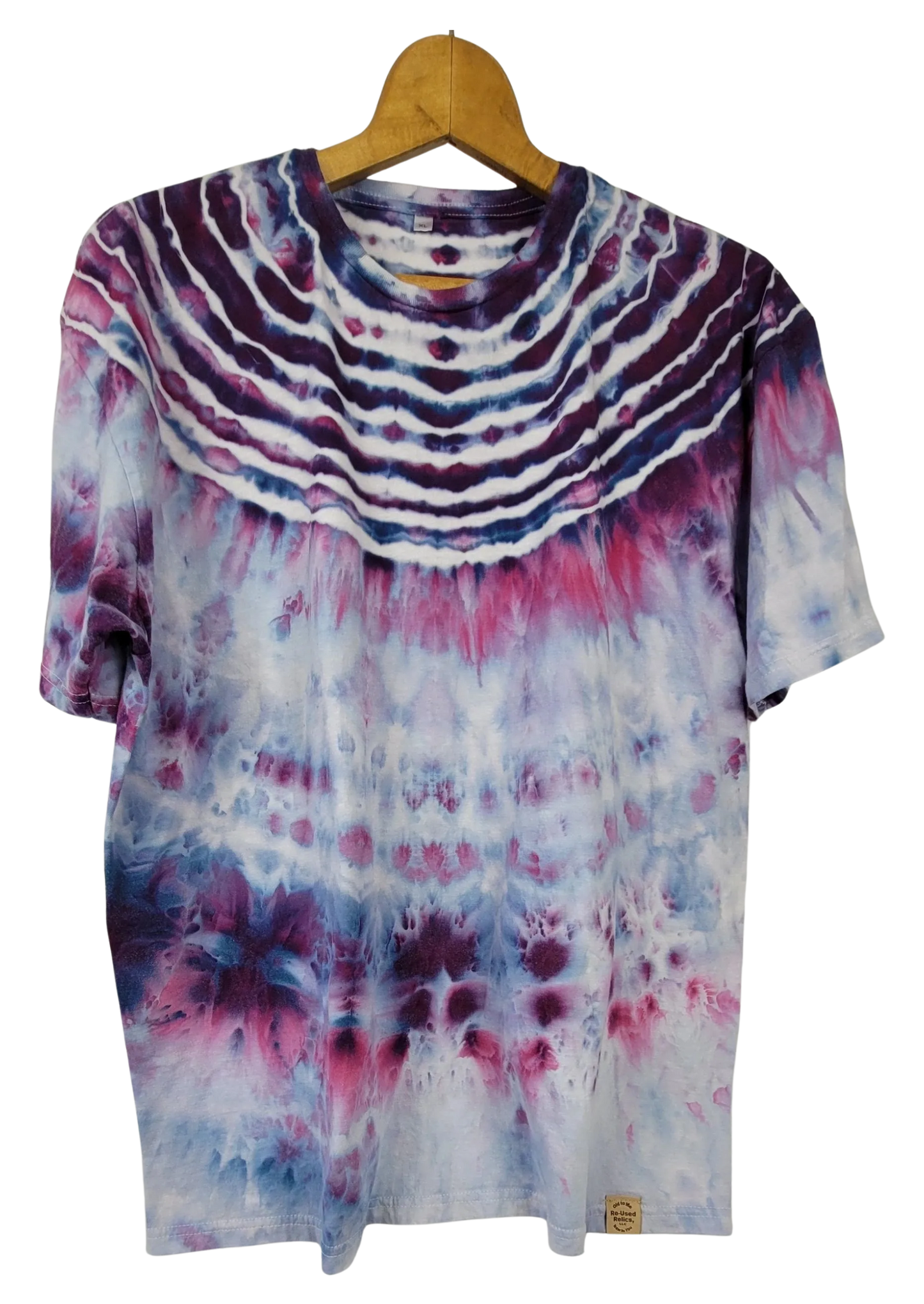 Tie-dye t-shirt on a wooden hanger with a white background
