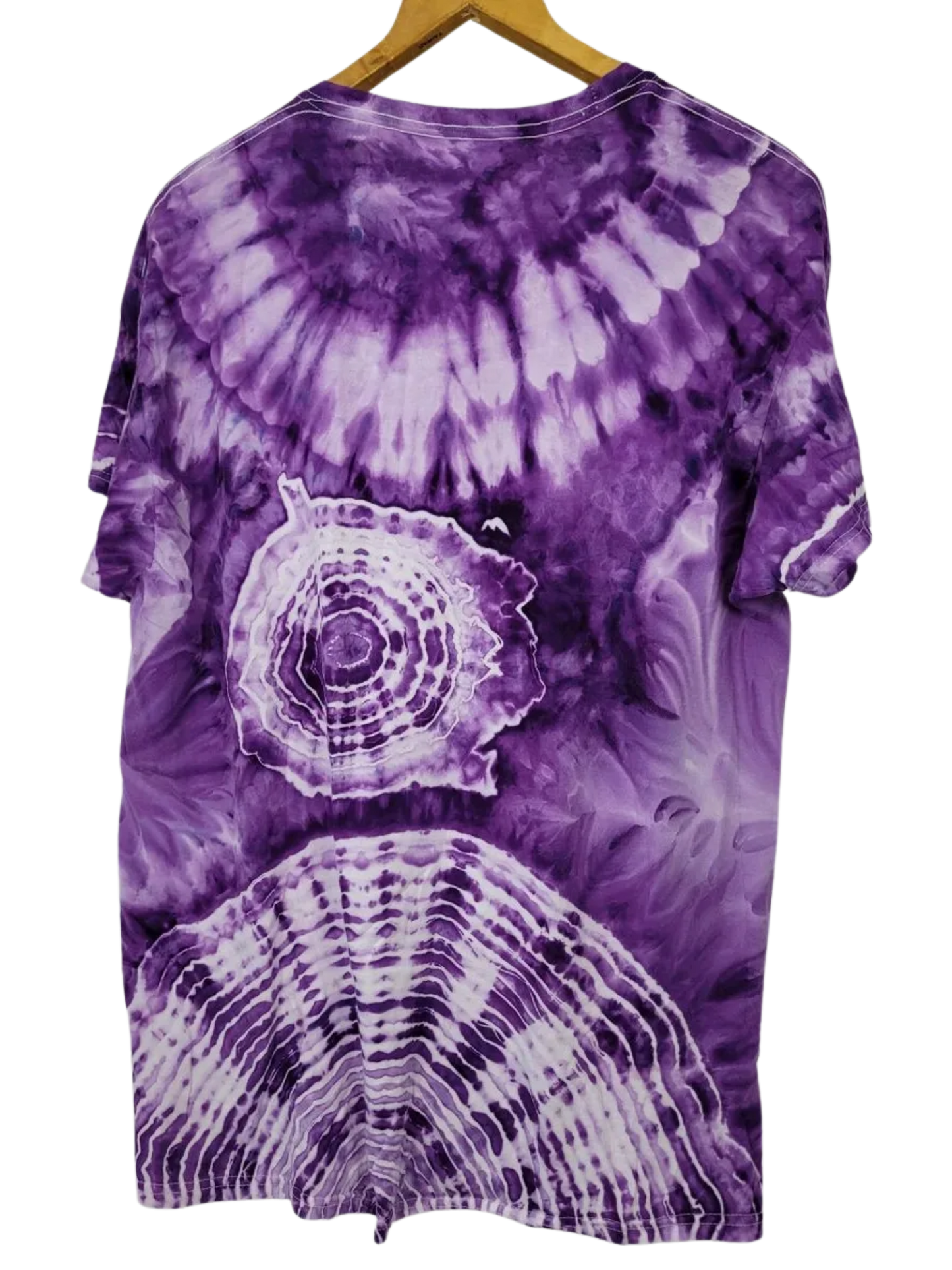 Purple tie-dye t-shirt with a circular pattern on a hanger against a white background