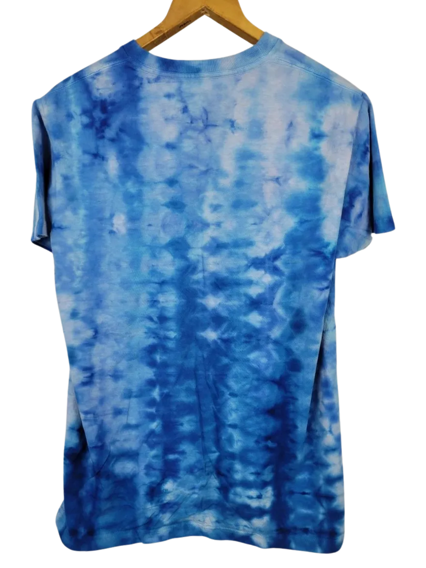 Blue tie-dye t-shirt on a hanger with a white background