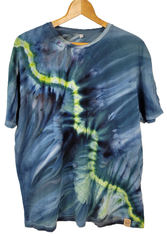 Tie-dye t-shirt with blue and green patterns on a white background