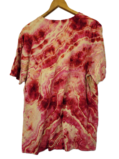 Marbled red and beige shirt on a hanger against a white background
