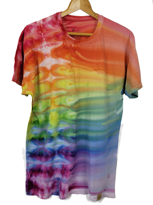 Multicolored tie-dye t-shirt on a hanger against a white background
