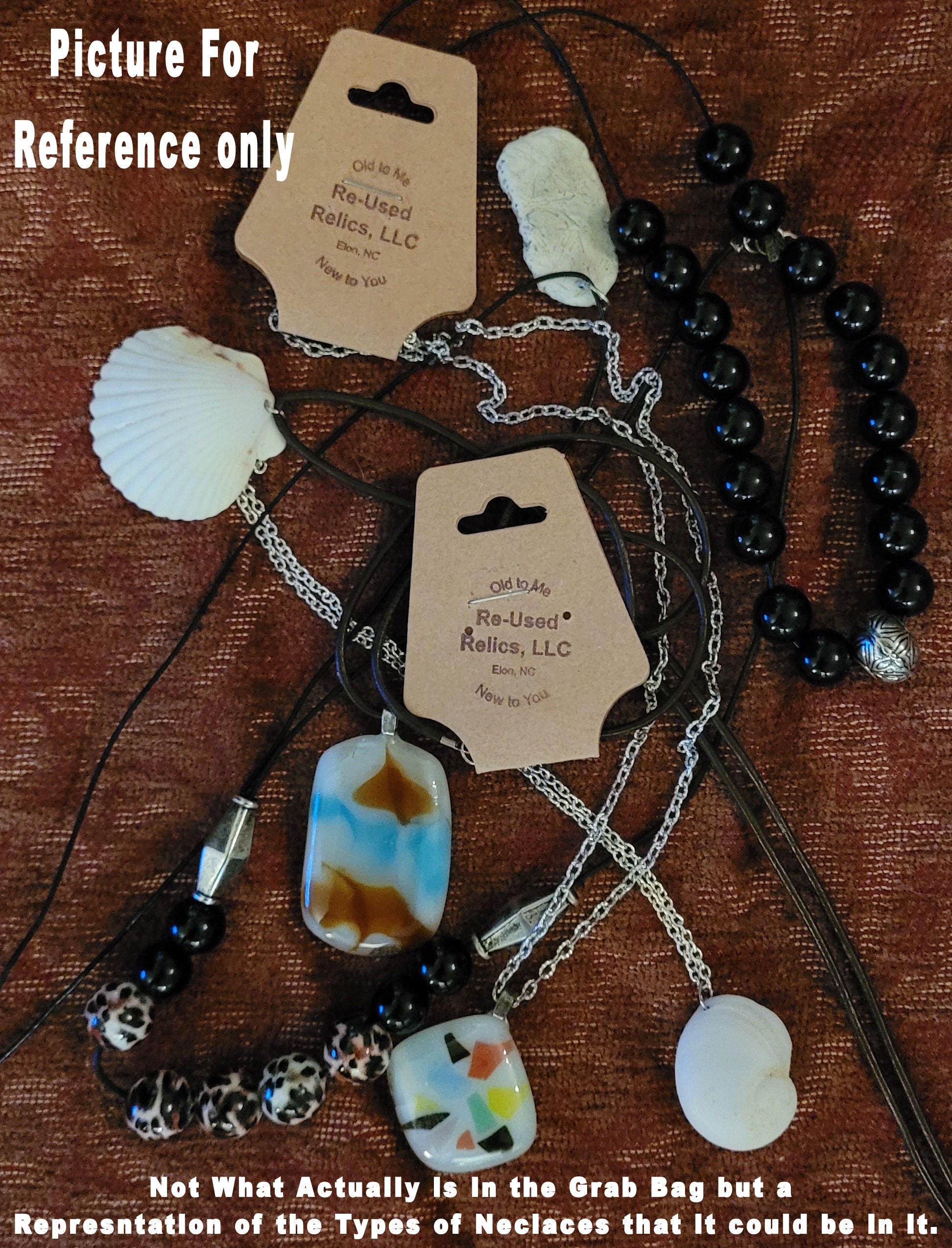 pile of various necklaces on a brown background