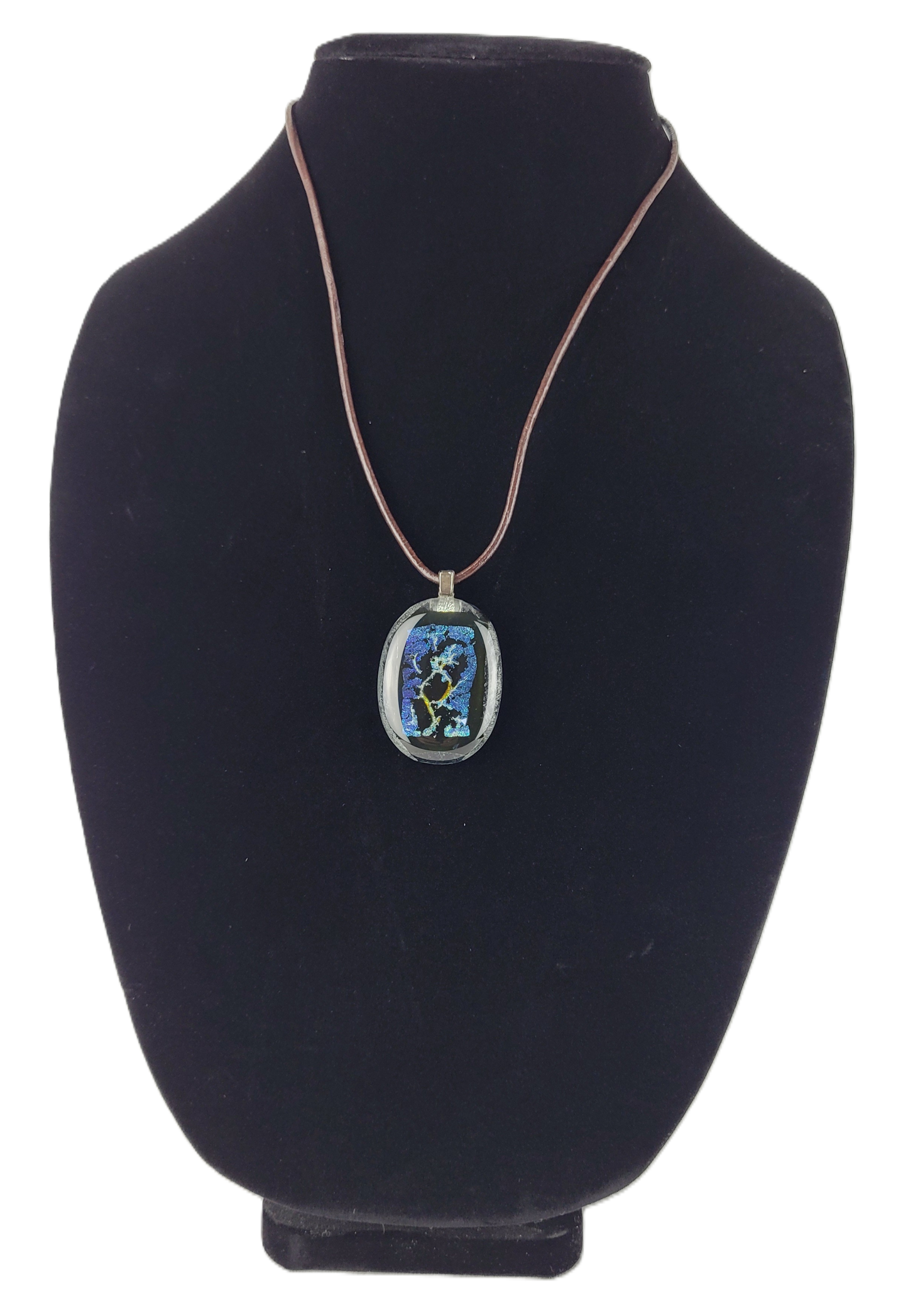 Necklace with a pendant on a black bust