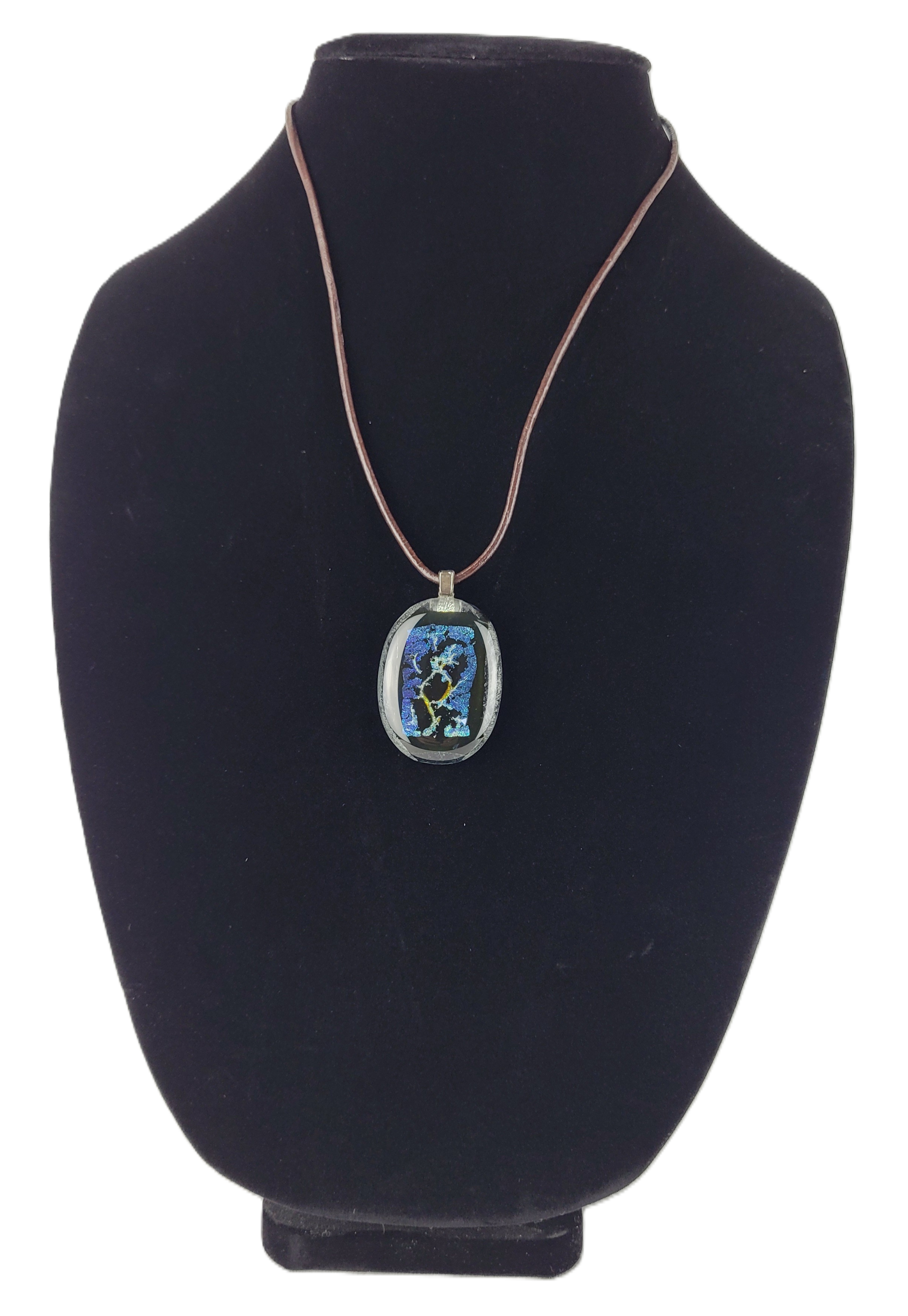 Necklace with a pendant on a black bust