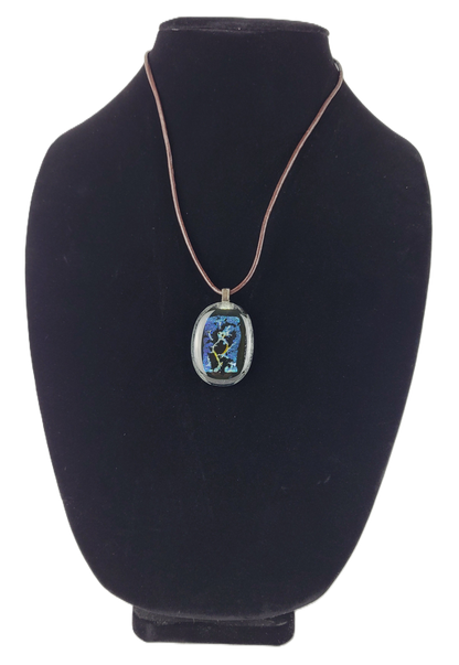 Necklace with a pendant on a black bust