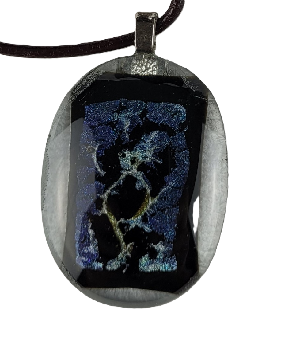 Pendant with black and blue design on a white background