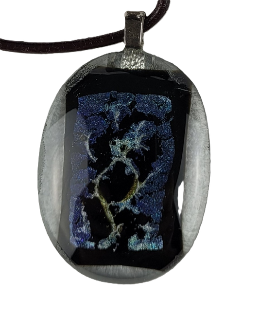 Pendant with black and blue design on a white background