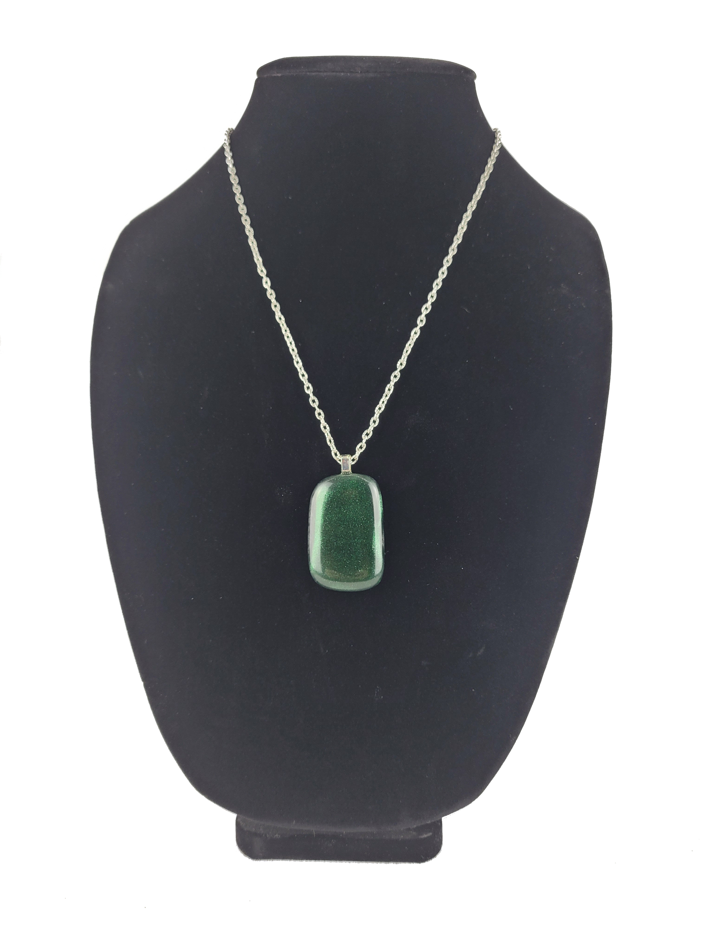 Green pendant necklace on a black bust