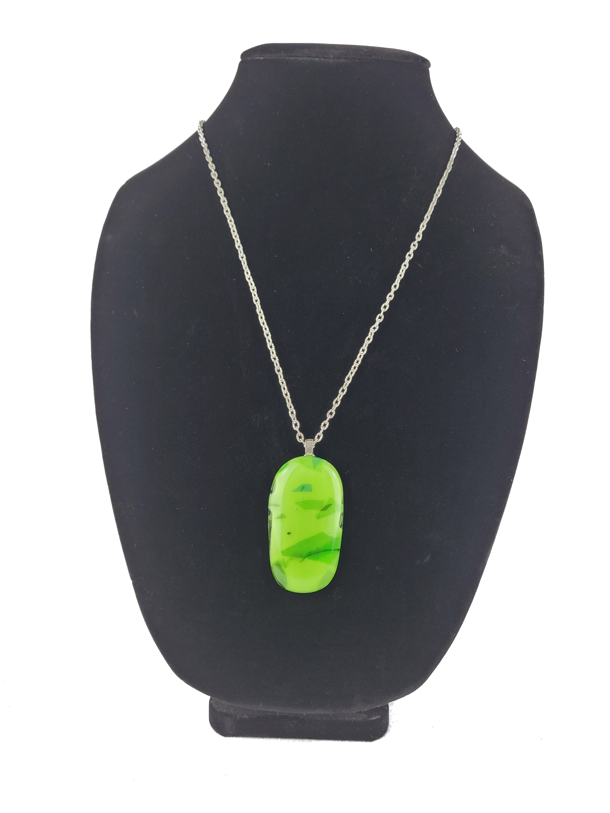 Neon green pendant necklace on a black mannequin bust
