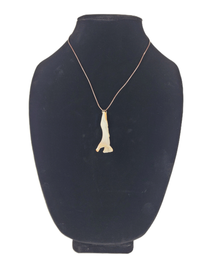 necklace with a pendant on a black mannequin bust