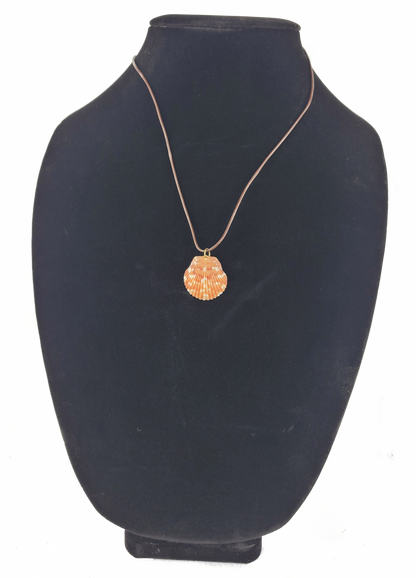 Necklace with a round pendant on a black mannequin bust
