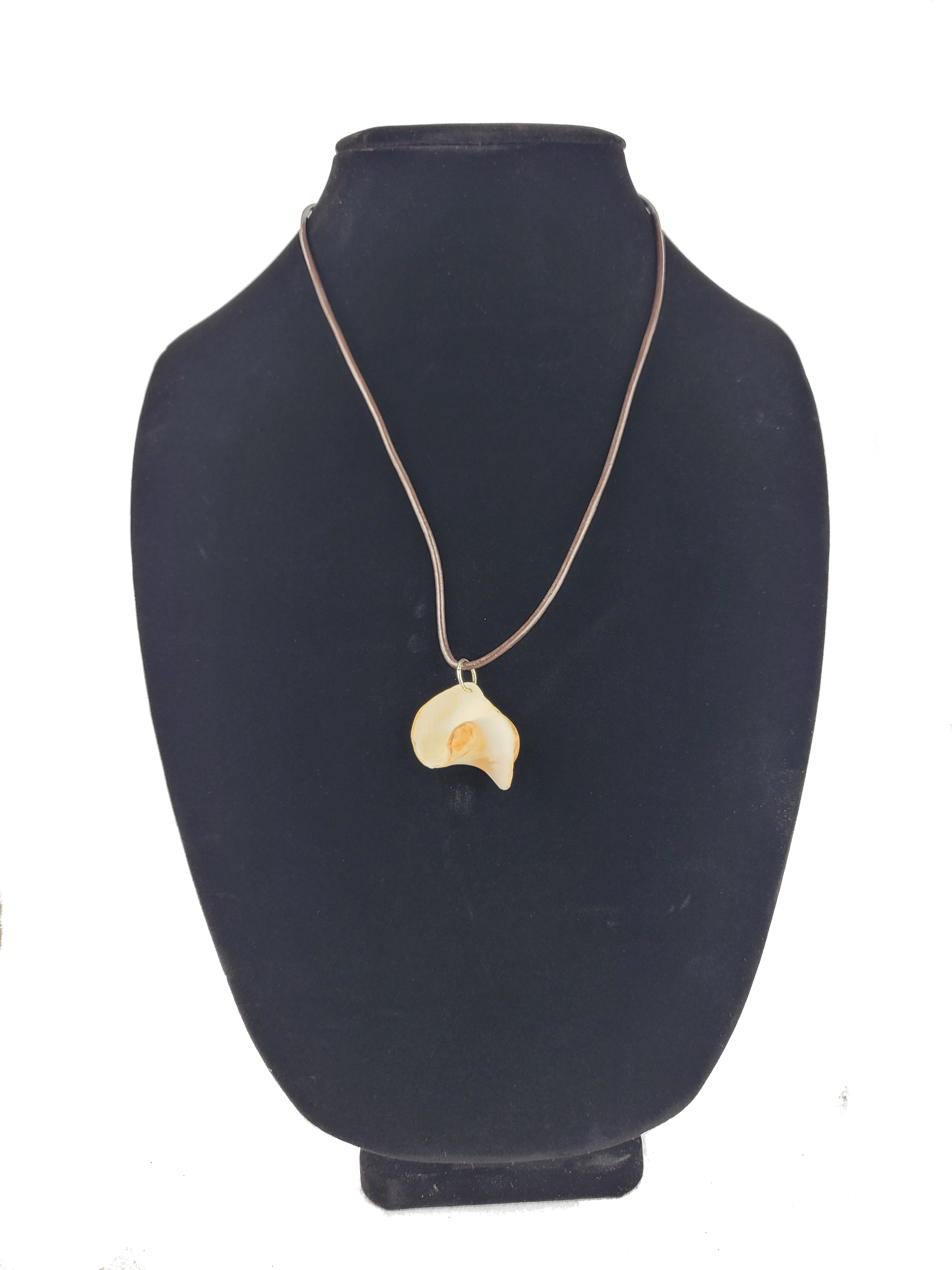 Necklace with a pendant on a black mannequin bust against a white background