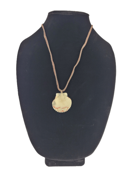 Shell pendant necklace on a black mannequin bust