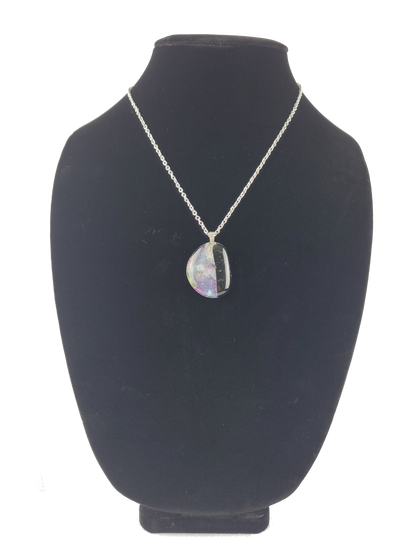 Necklace with a pendant on a black bust