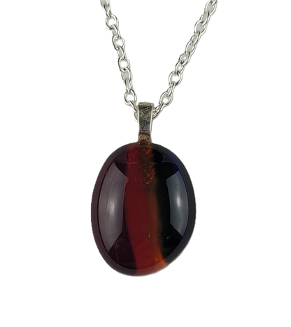 Necklace with a red oval pendant on a white background