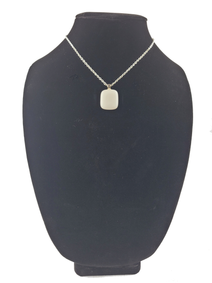 Necklace with a pendant on a black mannequin bust