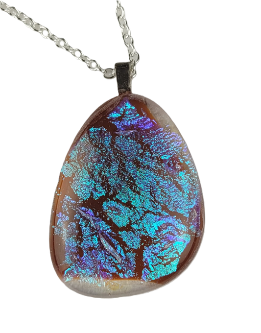 Teardrop-shaped pendant with blue and purple patterns on a white background