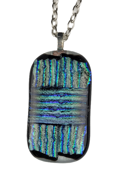 Rectangular dichroic glass pendant on a chain against a white background