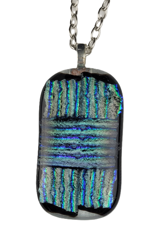 Rectangular dichroic glass pendant on a chain against a white background
