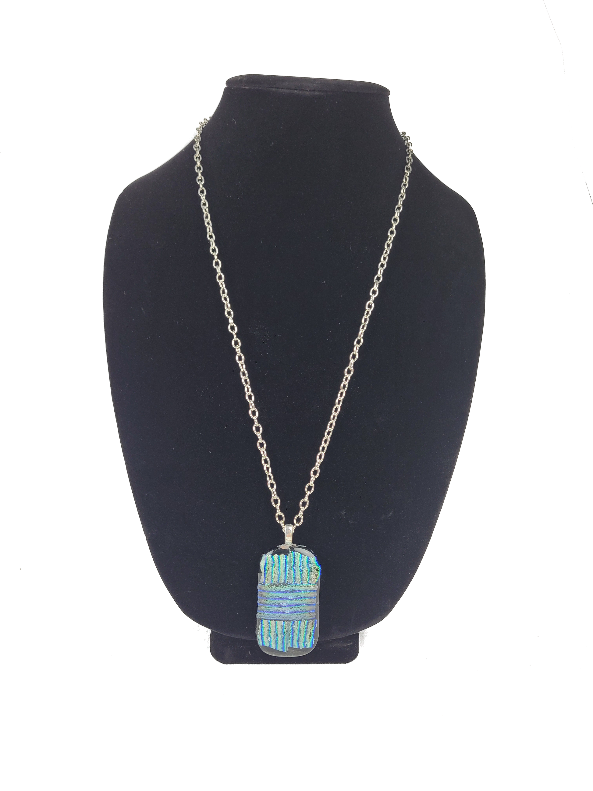 Necklace with a blue pendant on a black bust