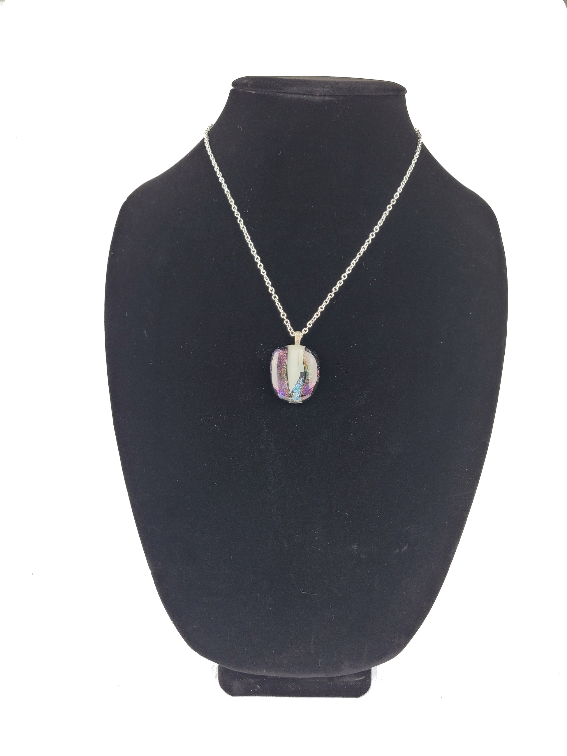 Necklace with a pendant on a black mannequin bust against a white background