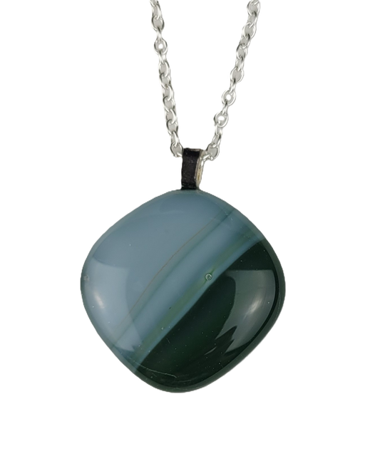 Green pendant necklace on a white background