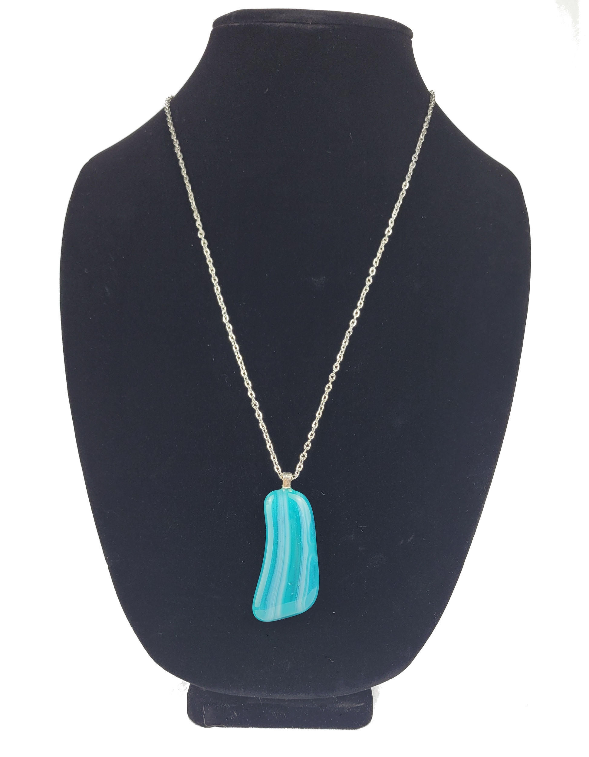 Turquoise pendant necklace on a black bust