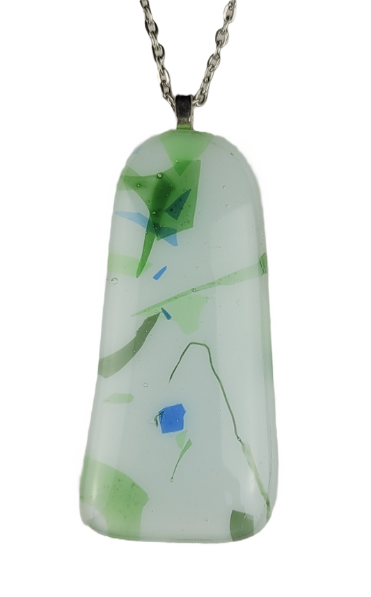 Glass pendant with green and blue abstract design on a white background
